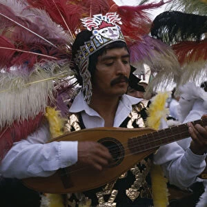 MEXICO, Mexico City Musicians wearing elaborate feather head-dresses