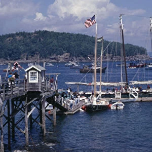 USA, Maine, Bar Harbour Wooden jetty with yacht moored at side