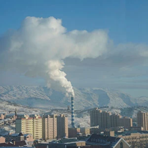 Smoke is seen from a chimney in Altay, Xinjiang Uygur Autonomous Region