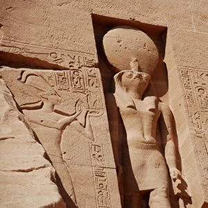 Statue of falcon-headed sun god Ra-Horakhty decorating facade of temple, The Great Temple, Abu Simbel, Nubia, Egypt