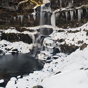 View of partially frozen waterfall with icicles, Uldale Force, River Rawthey, Baugh Fell, Howgill Fells, Cumbria