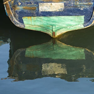 Africa, Morocco, Essouira. An artistic watercolor effect of a wooden boat floating