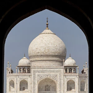 Asia, India. Taj Mahal entry gate, the Royal Gate with people in silhouette
