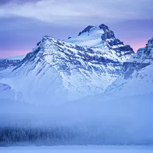 Canada, Alberta, Banff National Park, Dusk and fog at Mount Hector and Bow Lake