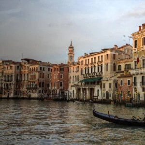 Evening light on Gondola along the Grand Canal near Rialto Bridge, Venice Italy