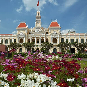 Flowers and historic Peoples Committee Building (former Hotel de Ville de Saigon)