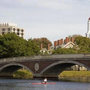 Rowing on the Charles River and Harvard University buildings in Cambridge, Greater Boston