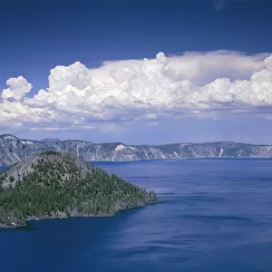 USA, Oregon. Crater Lake National Park, thunder clouds float over Wizard Island and Crater Lake