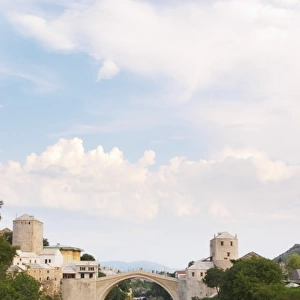 View along the river of the old reconstructed bridge. Historic town of Mostar. Federation