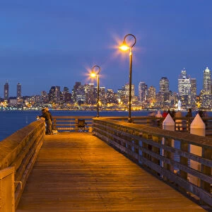 WA, Seattle, Seacrest Park fishing pier, with skyline view over Elliott Bay from West Seattle