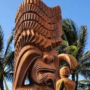 Wooden Polynesian statues at the entrance to Polynesian Cultural Center on the East coast of Oahu