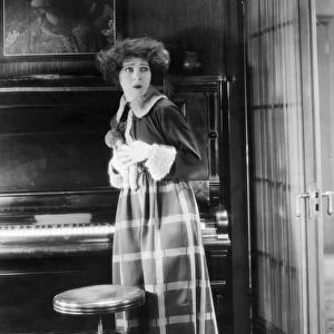 ALLA NAZIMOVA (1879-1945). American (Russian-born) actress. Nazimova as Nora in a scene from the 1922 American silent film version of Henrik Ibsens A Dolls House