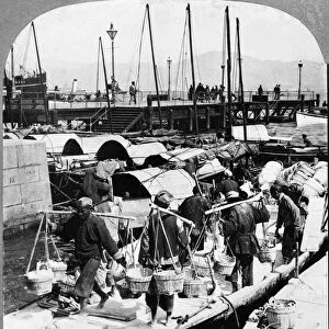CHINA: HONG KONG, c1902. Dock workers on the busy wharfs at Hong Kong, c1902. Stereograph