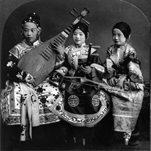 CHINA: MUSICIANS, c1919. A group of three Chinese child musicians in traditional dress