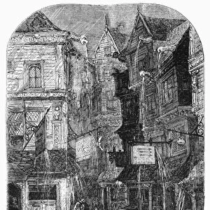 ELIZABETHAN LONDON. A London street on a rainy day during the reign of Queen Elizabeth I (1558-1603). Wood engraving, 19th century
