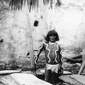 HOPI MAN, 1897. A Hopi man wearing a breechcloth and body paint, standing on a