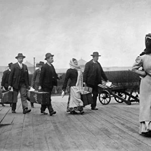 IMMIGRANTS: ELLIS ISLAND. A group of European immigrants photographed on Ellis Island