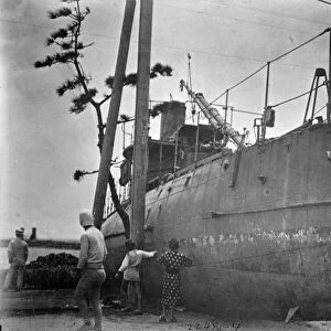 JAPAN: TYPHOON, c1911. Japanese torpedo boat driven ashore by a typhoon. Photograph
