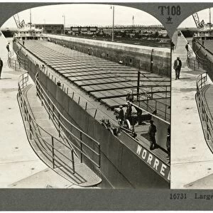 MICHIGAN: SOO LOCKS, c1920. A large iron ore ship coming through the Sabin Lock at Sault Ste