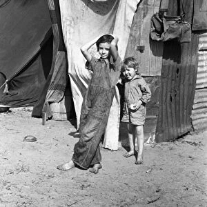 MIGRANT CHILDREN, 1937. Two children of a migrant fruit worker from Tennessee