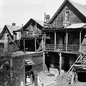 MILWAUKEE SLUM, 1936. Dilapidated homes in the slum section of Milwaukee, Wisconsin