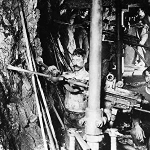 MONTANA: MINING, c1900. Miners operating drills in a mine in Butte, Montana. Photograph by N