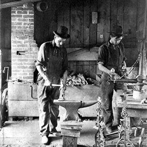 NEW YORK: METALSMITHS. Two metalsmiths working in the Roycroft Shop, East Aurora, New York