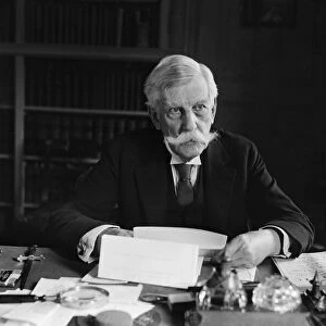 OLIVER WENDELL HOLMES, JR. (1841-1935). American jurist. Photographed seated at his desk