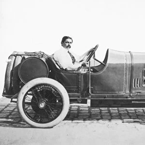 RACE CAR, 1914. Georges Boillot of France behind the wheel of the Peugeot he drove