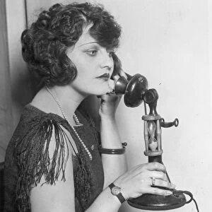 TELEPHONE CALL, 1920s. A still from a silent movie, American, 1920s