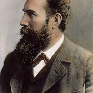 W. C. ROENTGEN (1845-1923). German physicist: oil over a photograph