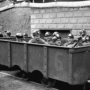 WEST VIRGINIA: COAL MINE. The next trip. Coal miners sitting in a mining car