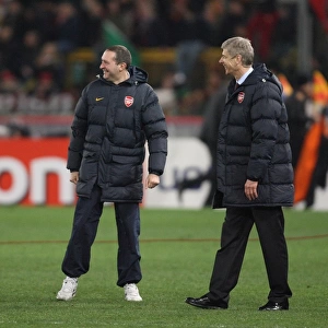 Arsenal manager Arsene Wenger & travel manager celebrate