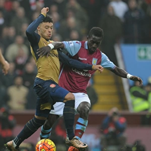 Arsenal's Alex Oxlade-Chamberlain vs. Idrissa Gana: Intense Battle in Aston Villa vs. Arsenal Premier League Clash