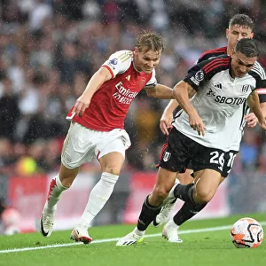 Arsenal's Martin Odegaard Clashes with Fulham's Joao Palhinha in Premier League Showdown at Emirates Stadium (2023-24)