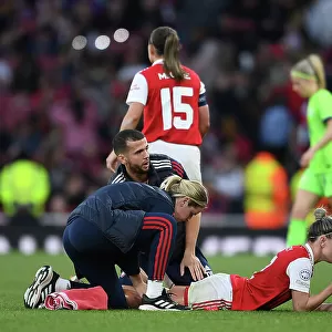Arsenal's Stepha Catley Receives Medical Attention Amidst Intense UEFA Champions League Semifinal Battle Against VfL Wolfsburg