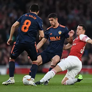 Xhaka vs Guedes: A Midfield Showdown in Arsenal's Europa League Battle with Valencia