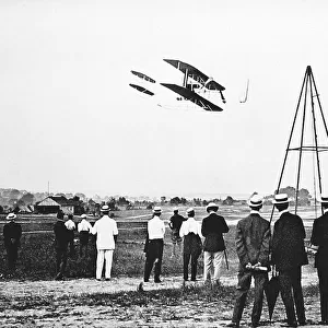 1909 - The Wright Brothers test fly their aircraft on Fort Myer's parade field