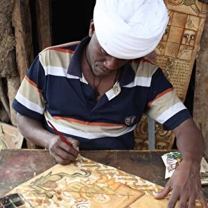 Artist painting religious themes in Lalibela