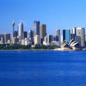 Australia, Sydney, city skyline from Garden Island to Farm Cove, seen across the water, showing skyscrapers and the Sydney Opera House
