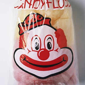 Bag of candyfloss with a clowns face on packaging