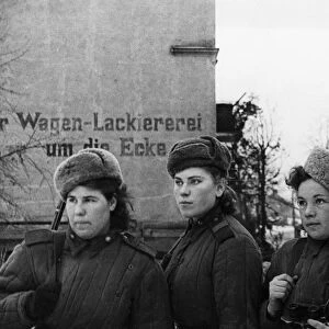 Third belorussian front, world war 2, a group of young women, red army snipers who have 2, 000 german kills between them, inspecting a small town in east prussia that has been taken by the soviet army, february 1945