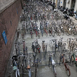 Bicycles in racks below street level in Bologna, Italy