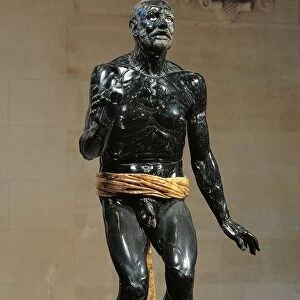 Black marble and alabaster statue of Old Fisherman, Roman copy of Hellenistic original