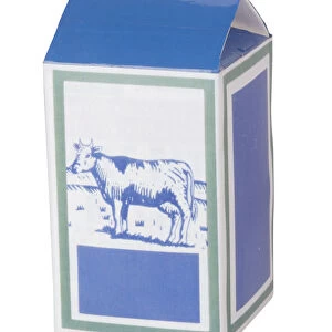 A blue carton of milk with a picture of a cow on its front