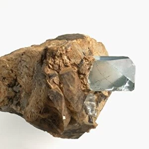 Blue topaz crystal in pegmatite groundmass