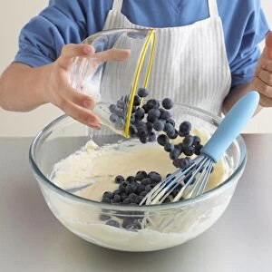 Blueberries being added to pancake batter