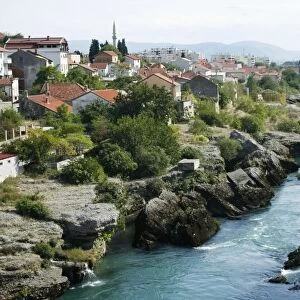 Bosnia and Herzegovina, Mostar, view of River Neretva and houses on rocky banks of the river