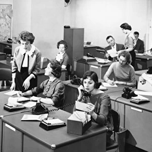 Busy office in the 1950-60s, black and white