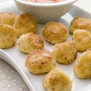 Cheese nuggets on tray, close-up